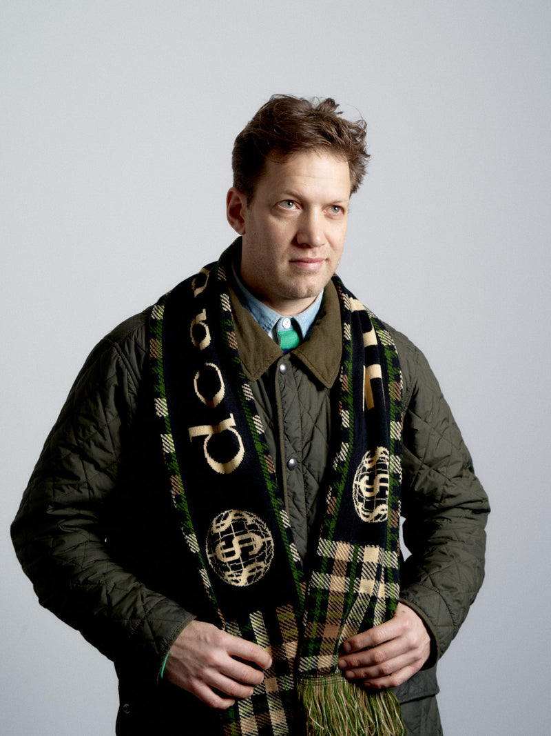 Man wearing a deadHYPE Tartan Scarf (Camo) against a plain background