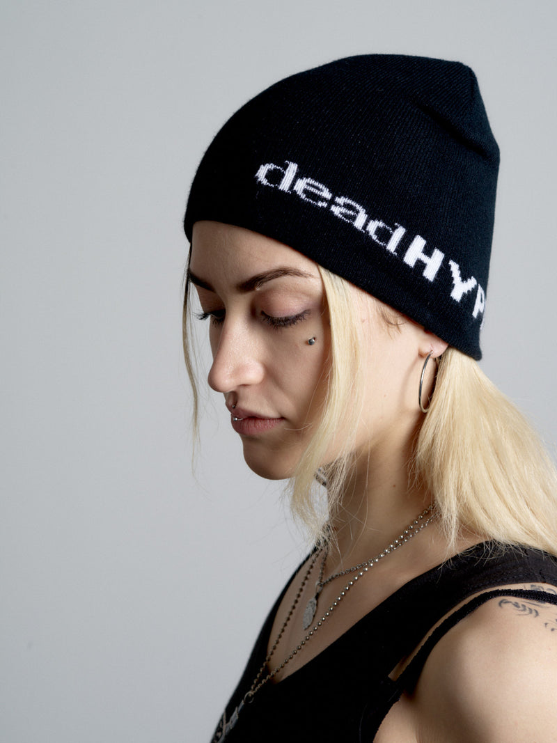 Person wearing a black beanie with 'deadHYPE' text on a plain background
