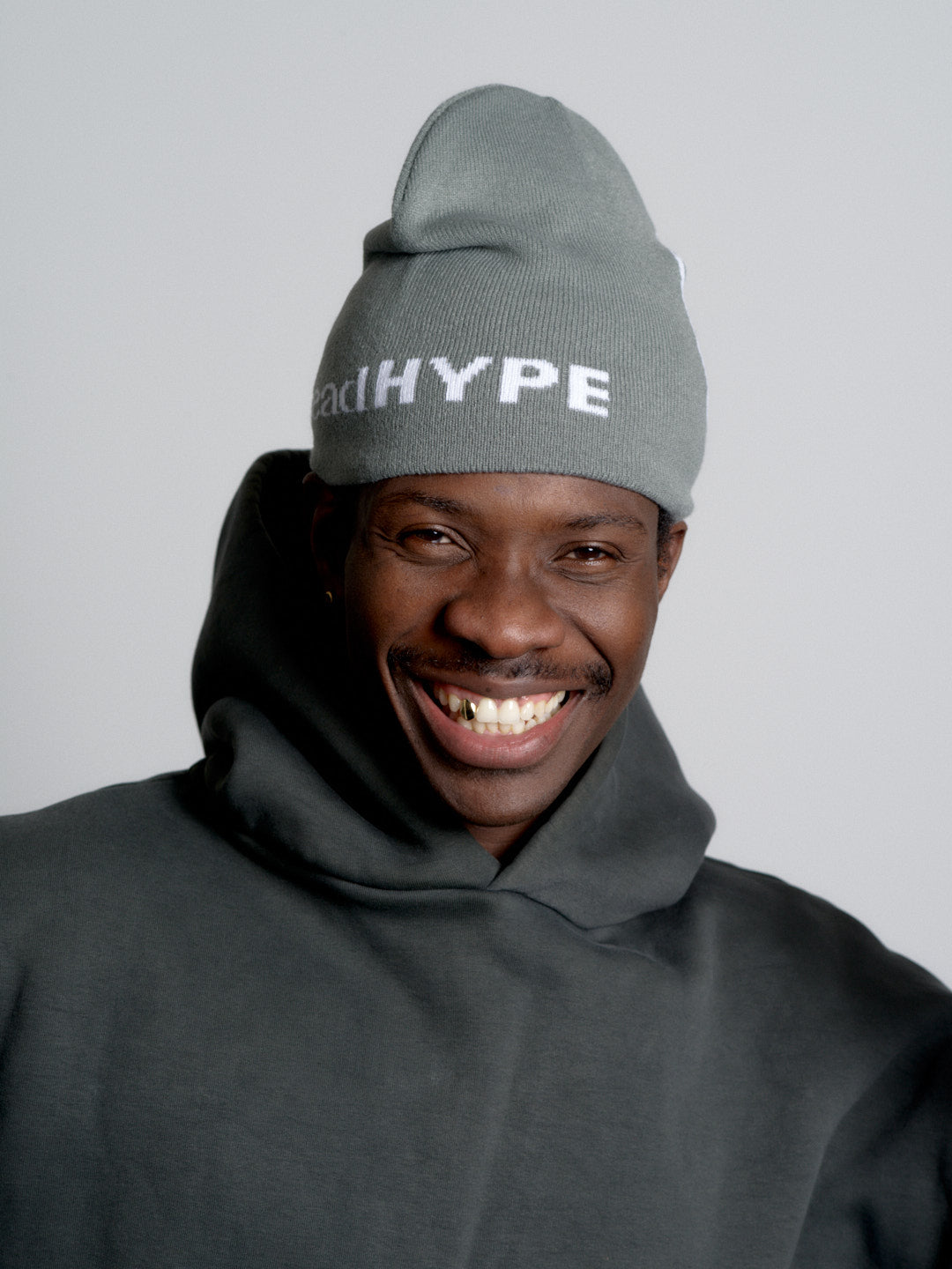 Person wearing a deadHYPE Graphic Beanie (Grey) against a plain background
