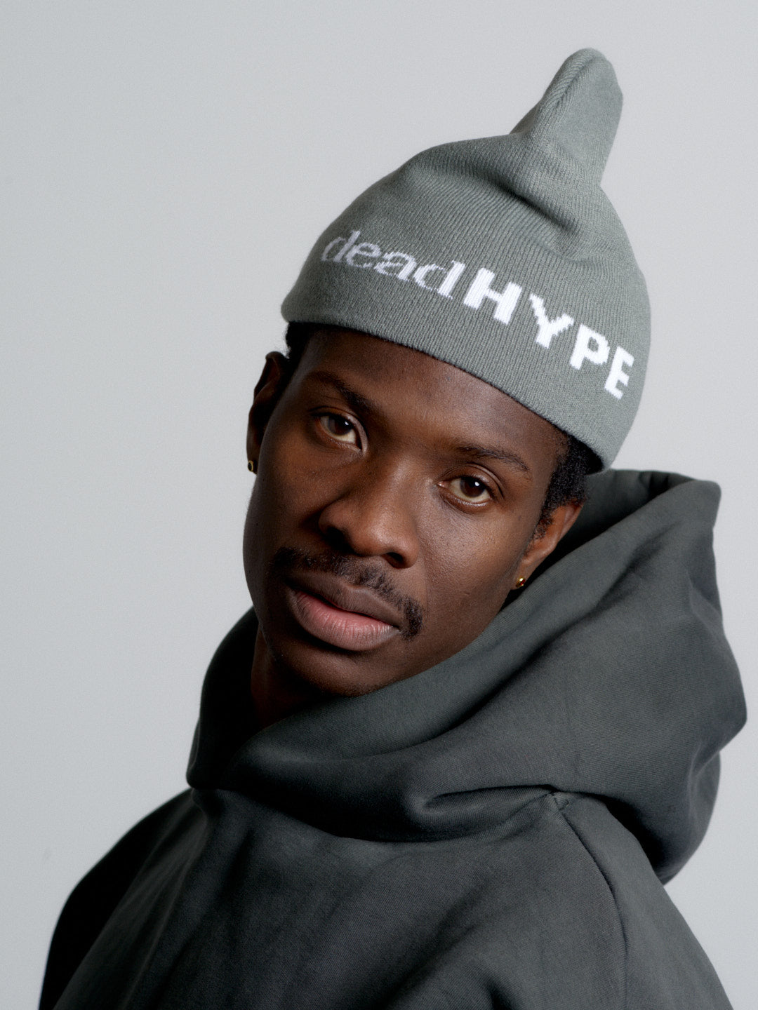 Person wearing deadHYPE Graphic Beanie (Grey) and a matching hoodie on a plain background