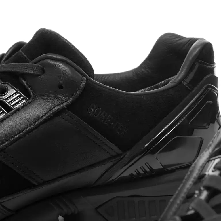 Close-up of a black Adidas ZX 8000 Deadhype GTX sneaker with a focus on the sole and brand logo.